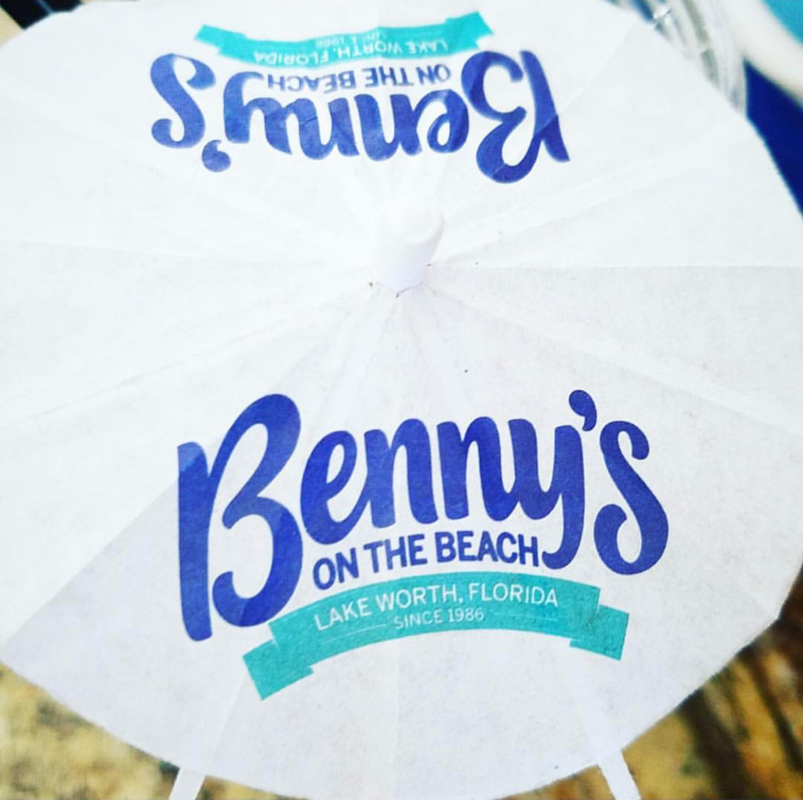 Branded beach umbrella for a pier restaurant for Benny's on the Beach, Lake Worth Beach, FL